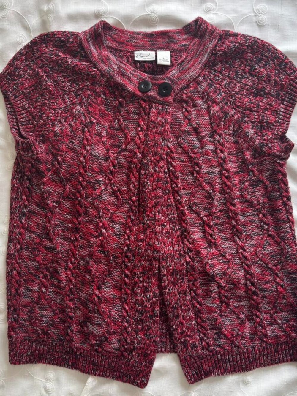 Red and black knitted sweater vest with two black button detail. Size: L